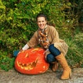 Woman showing huge Halloween pumpkin Jack OÃ¢â¬â¢Lantern Royalty Free Stock Photo